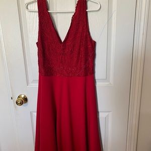 Red lace bodice with flowing skirt